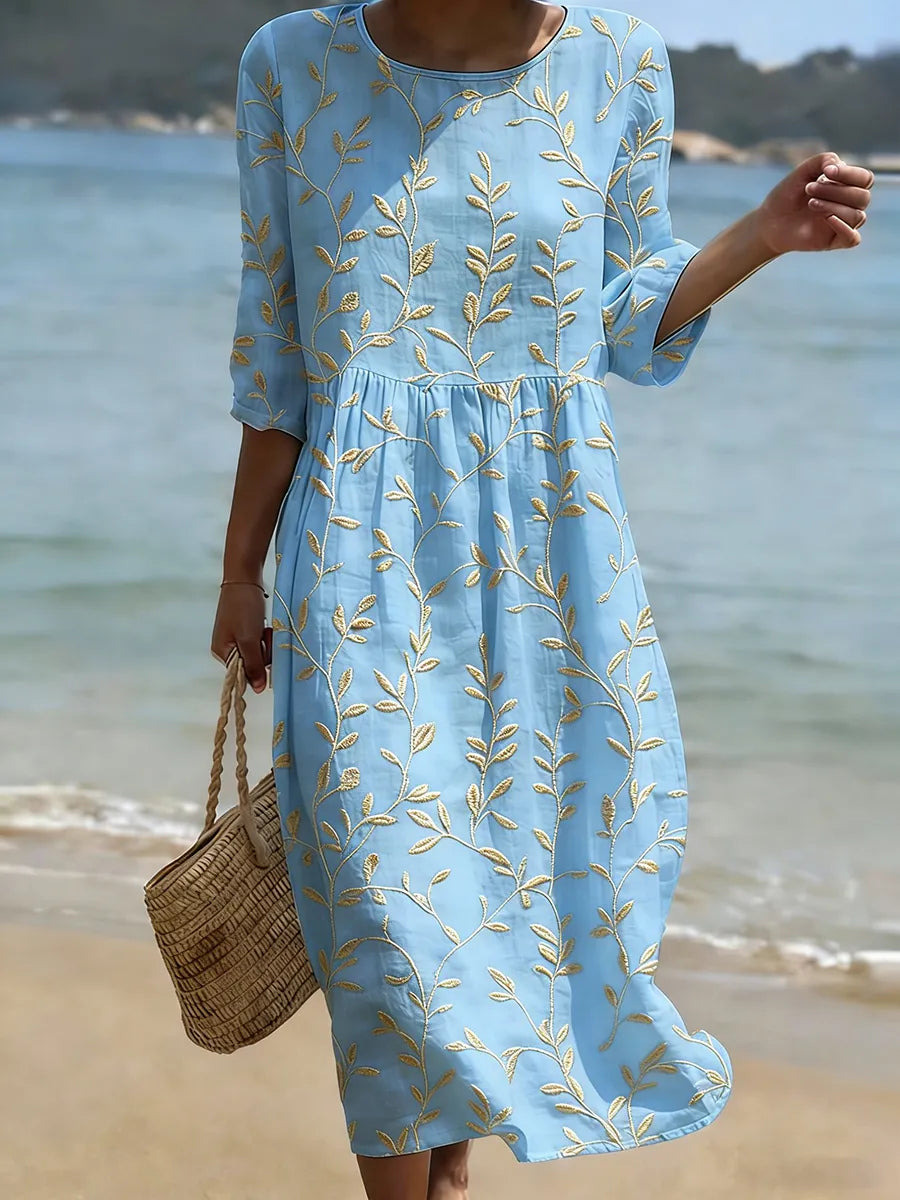 Florencia | Vestido azul bordado con flores de estilo vintage