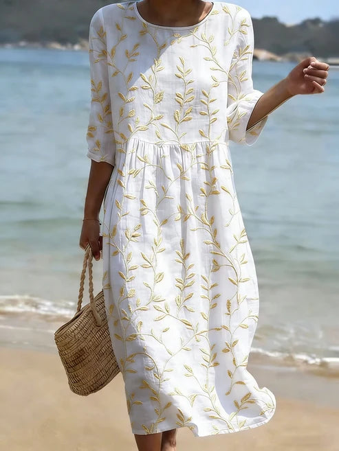 Florencia | Vestido azul bordado con flores de estilo vintage