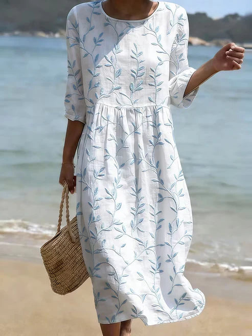 Florencia | Vestido azul bordado con flores de estilo vintage