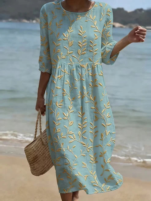 Florencia | Vestido azul bordado con flores de estilo vintage